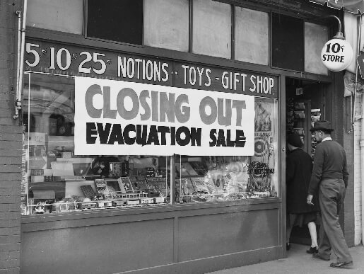 A photograph of a Japanese-owned store hosting an “evacuation sale” prior to relocation (1942)